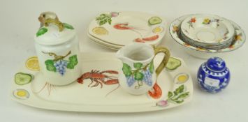 A seafood serving platter and four matching plates and other ceramics