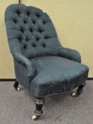 A green button back chair