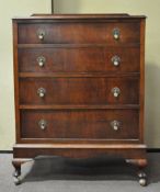 An oak chest of four long drawers