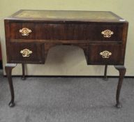 A mahogany leather top desk