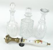 A Bass beer handle printed with huntsman and hounds and three cut glass decanters and stoppers