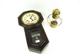 An Ansonia American drop dial regulator and a clock and a brass oil lamp