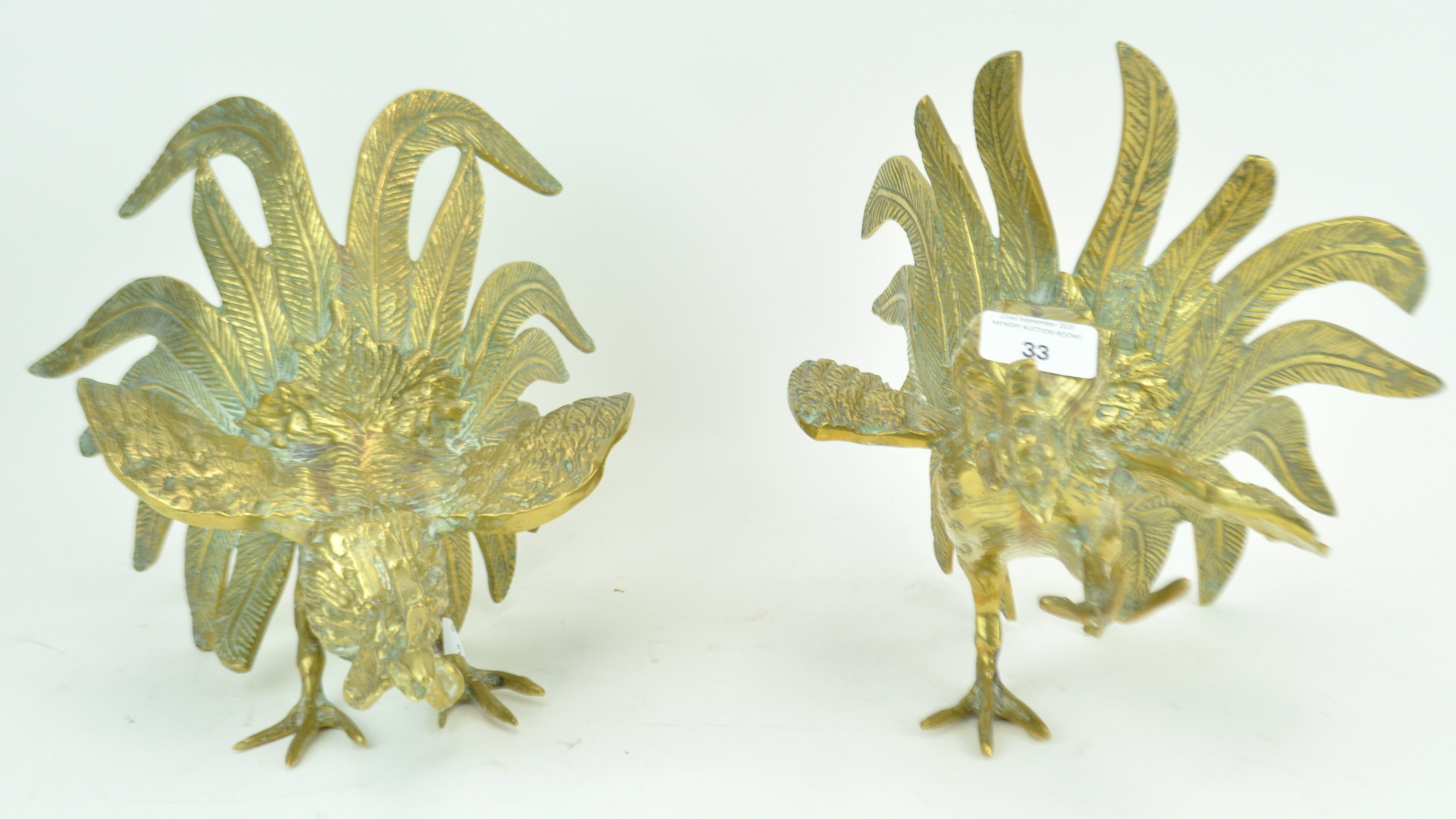 A pair of brass models of fighting cocks