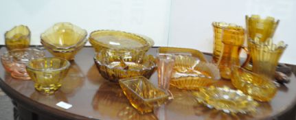 A collection of assorted 1930's amber gold pressed glass, to include vases,