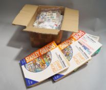 A box of world stamps with a bag of catalogues