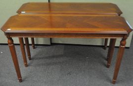 A pair of console tables