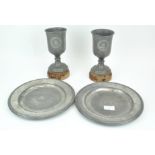 Two 19th century pewter chalice sets