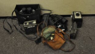 A group of assorted camera and binoculars