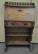 An oak Arts and Crafts style bureau