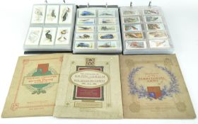 Six cigarette card albums (three with loose cigarette cards)