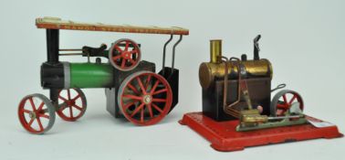 A Mamod steam traction engine and a steam wheel engine