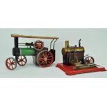 A Mamod steam traction engine and a steam wheel engine