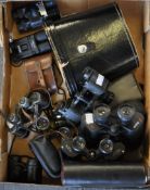 A quantity of binoculars,