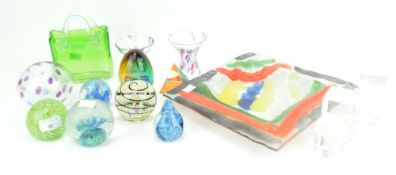 A glass dish and a group of paperweights