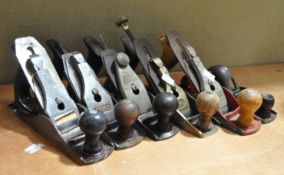 A collection of six wood planes