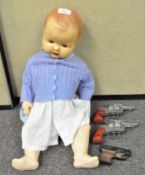 A 1950's doll and three cap guns