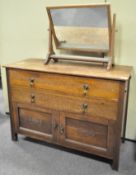 An oak cabinet and a mirror