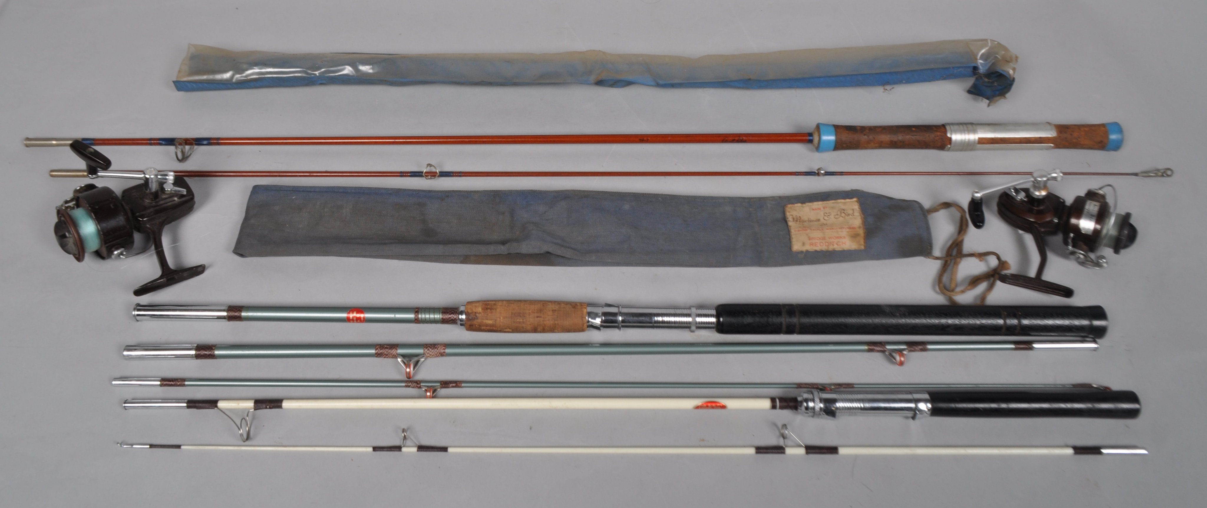A collection of spinning rods and reels