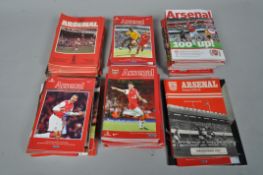 Two boxes of Arsenal football programmes and other memorabilia