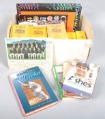 A box of cricket scrapbooks,