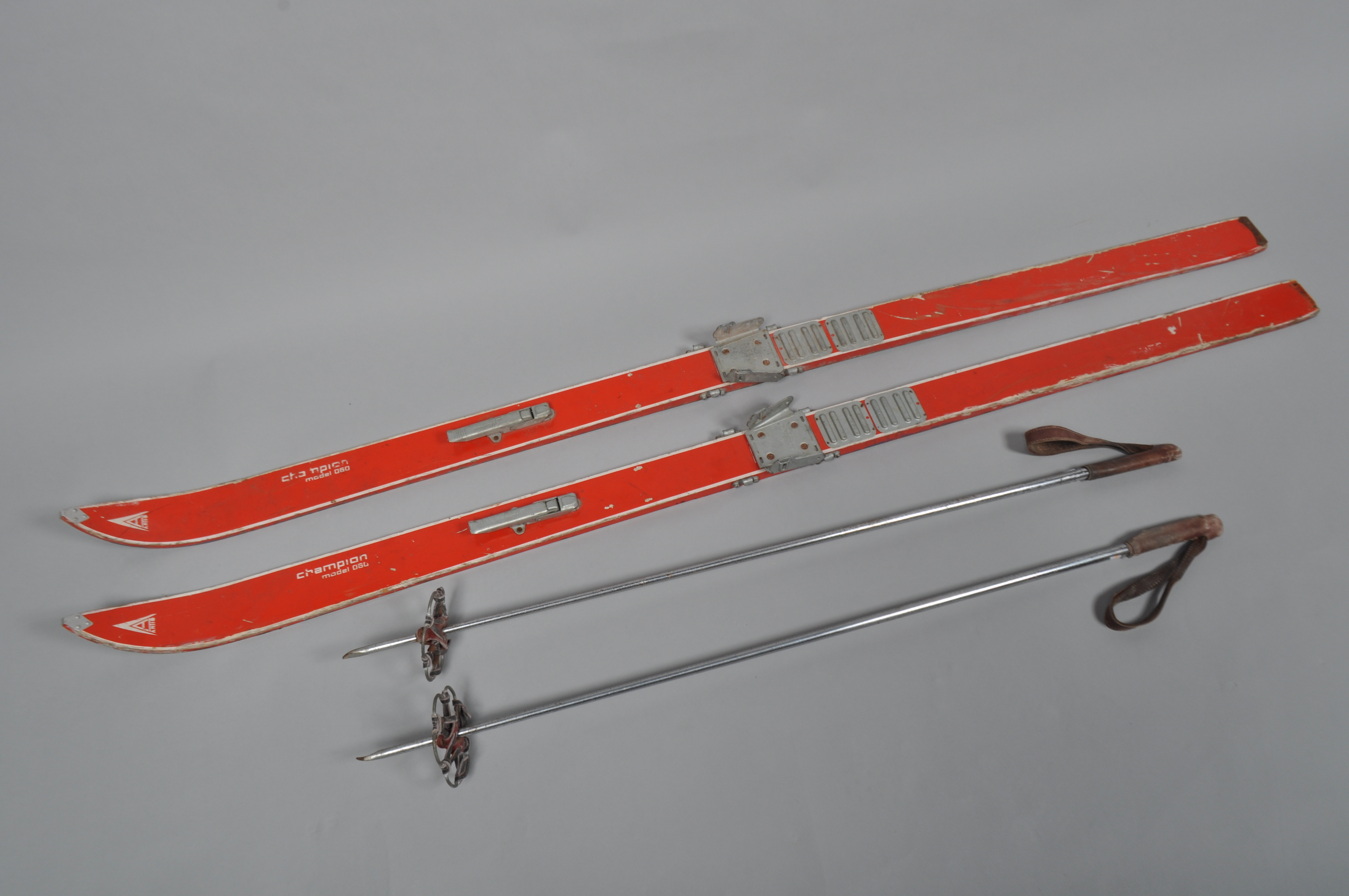 A pair of skis and poles Artis Champion model 060,