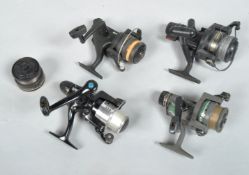 Four fixed spool reels including shimano,DAM and shakespeare