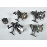 Four fixed spool reels including shimano,DAM and shakespeare