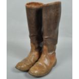 A pair of leather boots with label for J C Cording & Co Ltd