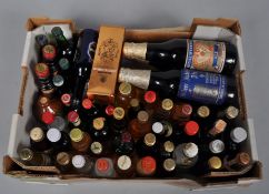 A collection of assorted of spirit and fortified wine miniatures and four bottles of commemorative