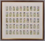 Fifty John Players "Cricketers" cigarette cards framed as one