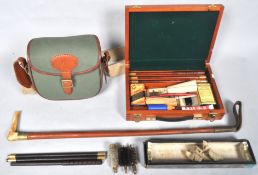 A cased gun cleaning kit, another in box,