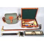 A cased gun cleaning kit, another in box,