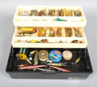 Cantilever tackle box containing a quality of vintage pike fishing plugs and spoon