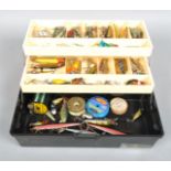 Cantilever tackle box containing a quality of vintage pike fishing plugs and spoon