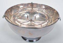 A large silver plate punch bowl with wirework bottle holder insert, diameter 40cm,