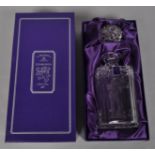 An Edinburgh crystal decanter etched with a golfer in fitted case