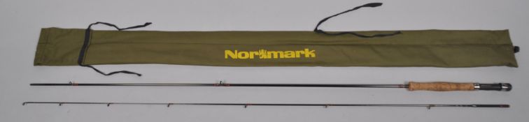 A Normark CF1022 8'6" fly rod and bag