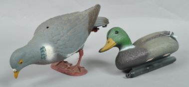 A plastic decoy wood pigeon and similar duck