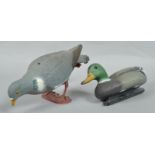 A plastic decoy wood pigeon and similar duck