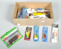 A box of approximately 25 new fishing lures