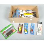 A box of approximately 25 new fishing lures