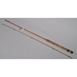 A Milwards 6'9" two piece vintage spinning rod