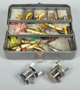 Metal cantilever tackle box containing mainly vintage north American lures,