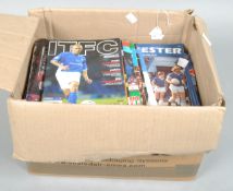 A box of International and Cup Final football programmes