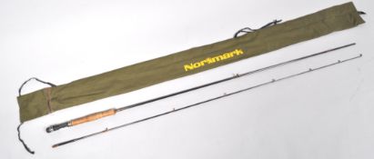 A Normark CF1022 8'6" fly rod and bag