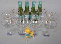 A collection of Babycham glasses together with four bottles and a plastic Babycham Bambi figure