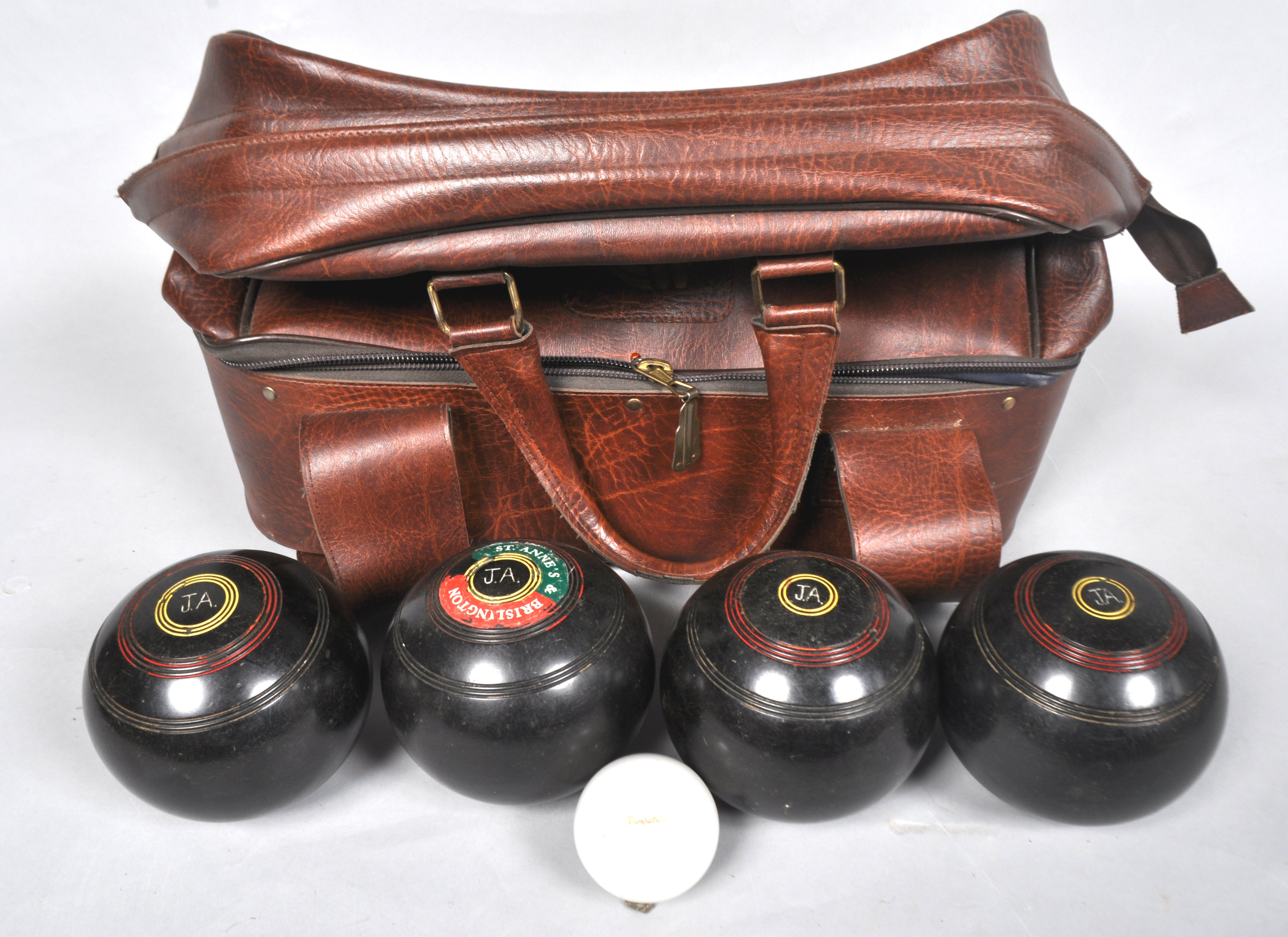 Four bowling balls in bag