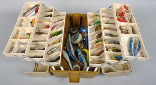 A cantilever tackle box containing approximately 80+ plugs, spinners,