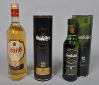 A bottle of Glenfiddich 12 year old single malt whisky and other bottles