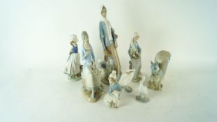 A group of Lladro and other figures